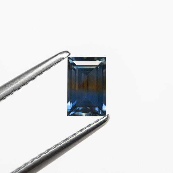 0.54ct 5.66x3.70x2.41mm Rectangle Step Cut Sapphire 23470-01